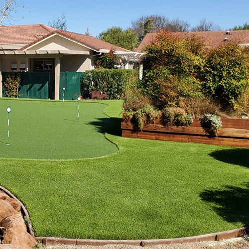 artificial grass putting green installed at a home