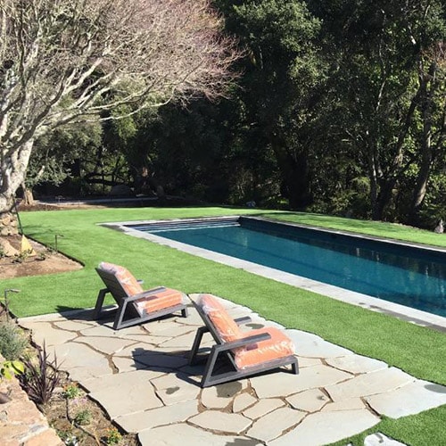 realistic synthetic lawn installed by a pool