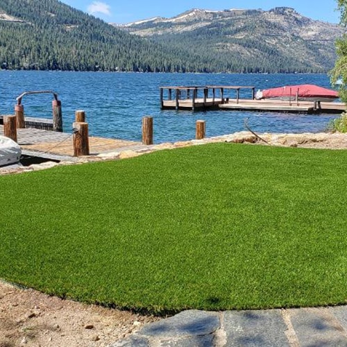 artificial grass installed in a home by a lake